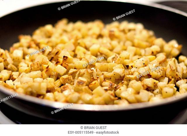 Potatoes Frying in a Pan