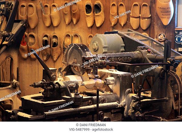 Machine in a workshop used to make traditional Dutch wooden shoes in the small town of Zaanse Schans, Holland, Netherlands, Europe