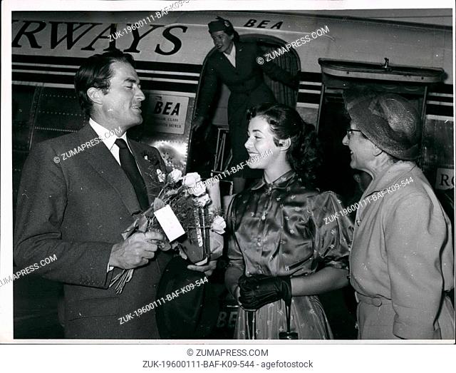 1962 - Beaming as always Gregory Peck the plane on Berli Airport Tempelhof. The American movie actor was received by the young American actress s Rita Gan with...