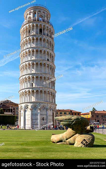 PISA, TUSCANY/ITALY - APRIL 17 : Exterior view of the Leaning Tower of Pisa Tuscany Italy on April 17, 2019. Three unidentified people