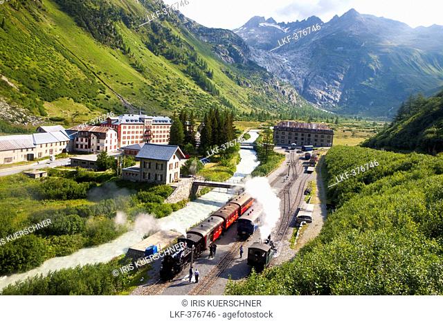 Village and train station of Gletsch, steam train and steam lokomotive of Furka steam mountain railway, Wallis, Valais, Switzerland