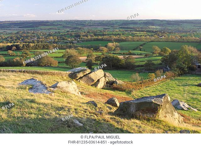 View of surrounding farmland, gritstone rocks and valley from Almscliff Crag rock formation, North Rigton, North Yorkshire, England, october