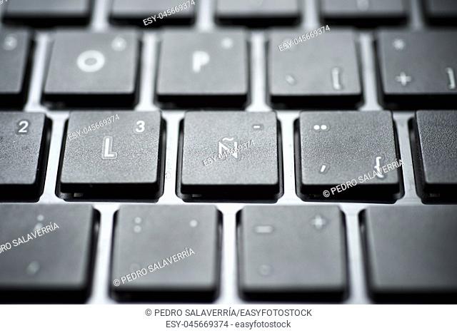 Spanish letter on a gray laptop keyboard