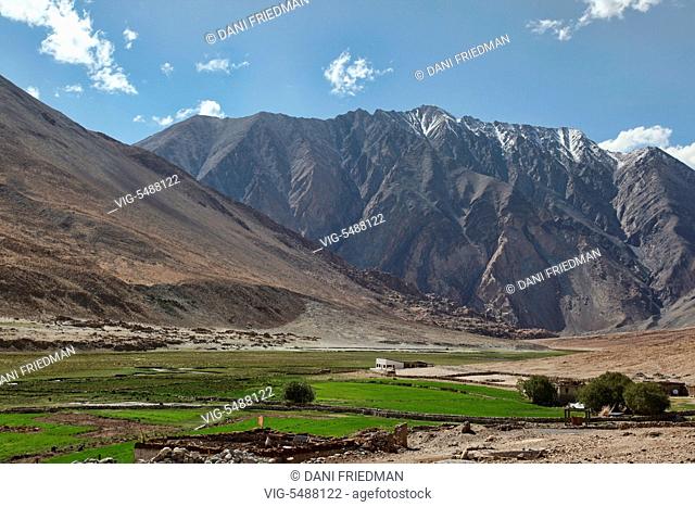 Villages nestled high in the mountains in Muglub, Ladakh, Jammu and Kashmir, India. - MUGLUB, LADAKH, INDIA, 05/07/2014
