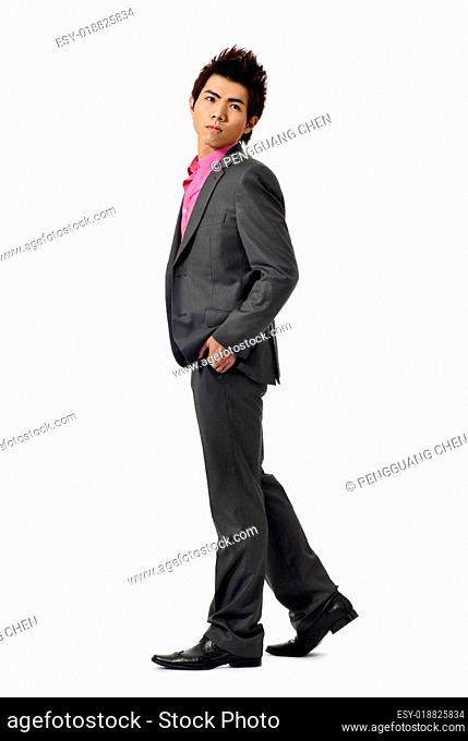 Young businessman walking