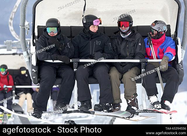 RUSSIA, SOCHI - DECEMBER 1, 2023: Skiers use a chairlift at the opening of a new alpine skiing season at the Krasnaya Polyana resort