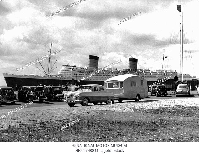 1952 Ford Zephyr towing Winchester Pipit caravan Queen Elizabeth in B/g. Creator: Unknown