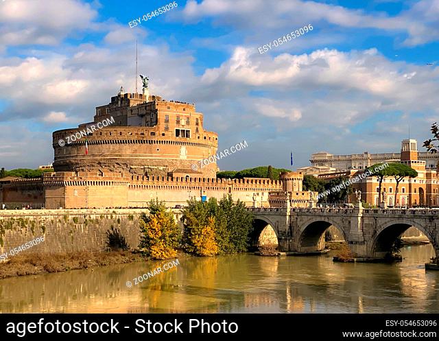 The mausoleum of Hadrian, known as Castel Sant'Angelo, with the bridge over the Tiber river on a sunny day in Rome. Famous place and tourist destination