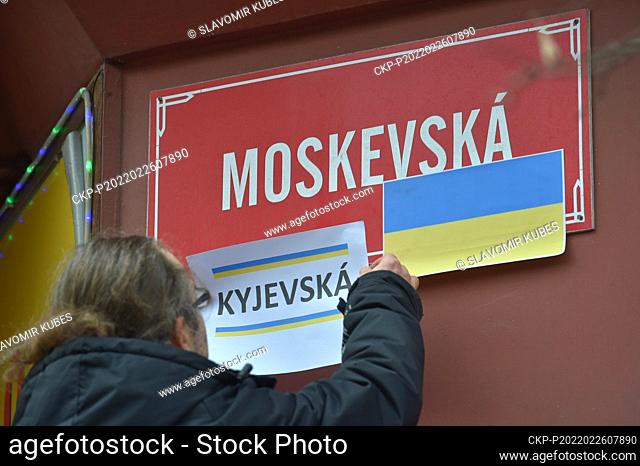 Activist put the paper with instription Kiev Street on a sign reading Moscow Street during a demonstration in support of Ukraine in Karlovy Vary, Czech Republic