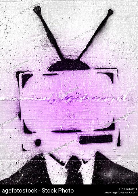 Addicted man holding vintage tv instead of head. Television manipulation and brainwashing concept. Mass media propaganda control