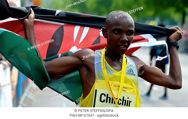 Kenya's Henry Kipsigei Chirchir cheers as he crosses the finish line to win the marathon in Hanover, Germany, 27 April 2014