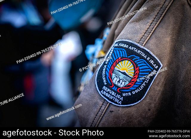 01 April 2022, Argentina, Ushuaia: ""Tierra del Fuego, Antarctic and South Atlantic Islands - Argentine Republic, "" reads a coat of arms on the jacket of a war...