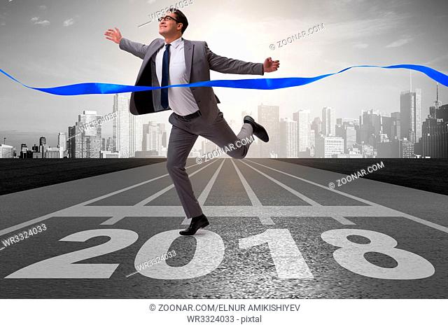 Businessman running towards new year 2018
