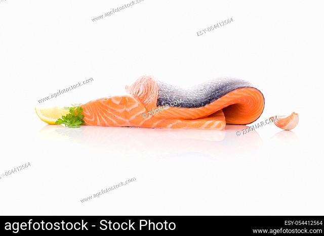 Raw salmon steak isolated on white background. Sashimi sushi. Luxurious healthy seafood eating