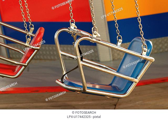 Seats of a merry go round in an amusement park at Navy Pier in Chicago