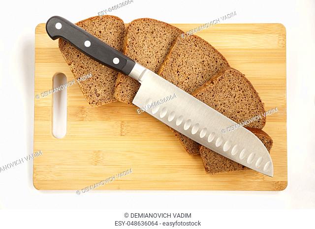 Knife cook universal with a blade like Santoku on a chopping board