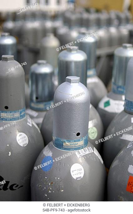 Natural gas in bottles, close-up, selective focus