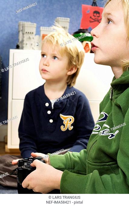 Two Scandinavian boys playing video games, Sweden