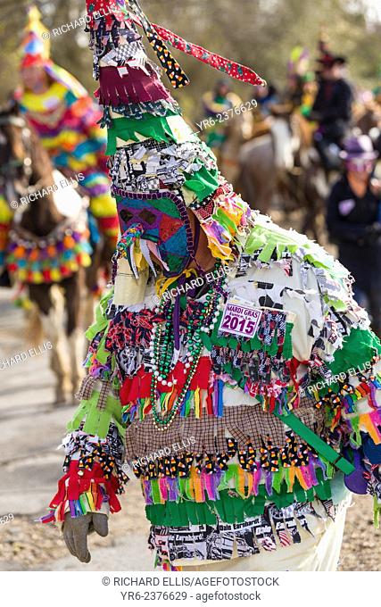 Traditional Cajun Mardi Gras costumed reveler dances during the Courir de Mardi Gras chicken run on Fat Tuesday February 17, 2015 in Eunice, Louisiana