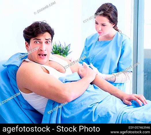 The doctor doing medical injection in hospital room