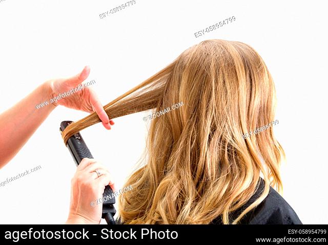 Closeup of a makeup artist applying makeup. Isolated at white background