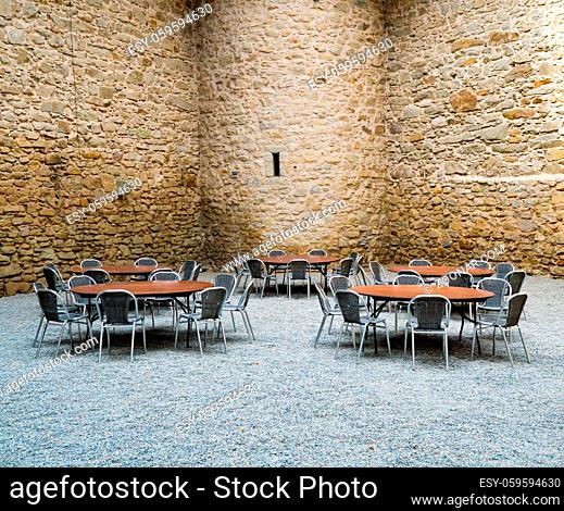 Rapperswil, SG / Switzerland - 3. August 2019: castle courtyard with defense walls and table and chair seating for a dinner party