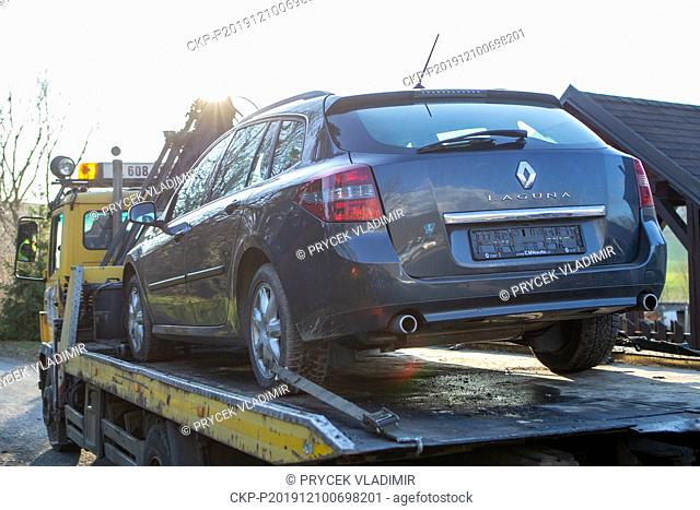 A car in which a shooter shot himself before the police arrival is towed away by a tow truck in Dehylov, a village situated some eight kilometres from the...