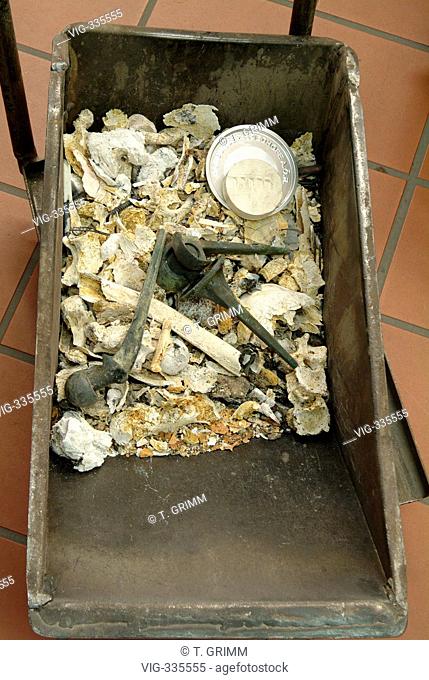 Cremation in Hamburg crematorium on the cemetery Hamburg Oejendorf. The picture shows the remaining human ashes with a numbered identification stone and...