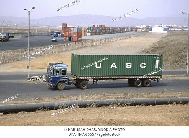 trucks carrying containers in yard , bombay mumbai , maharashtra , india