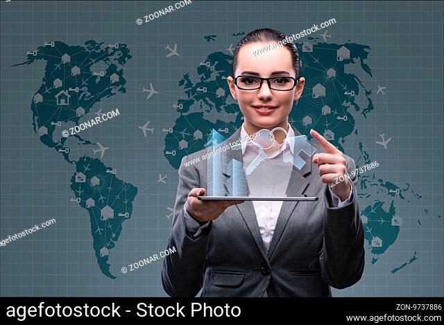 Businesswoman with tablet in hotel booking concept