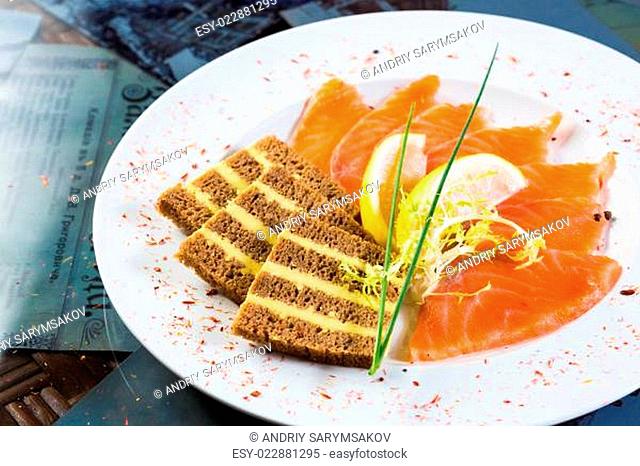 Salmon snack on the white plate