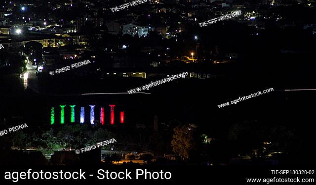 A view of Temples Valley lighting with the colours of Italian flag in Agrigento , ITALY-18-03-2020
