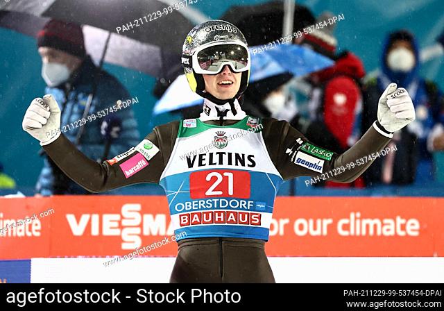29 December 2021, Bavaria, Oberstdorf: Nordic skiing/ski jumping: World Cup, Four Hills Tournament. Lovro Kos from Slovenia cheers after his jump in second...