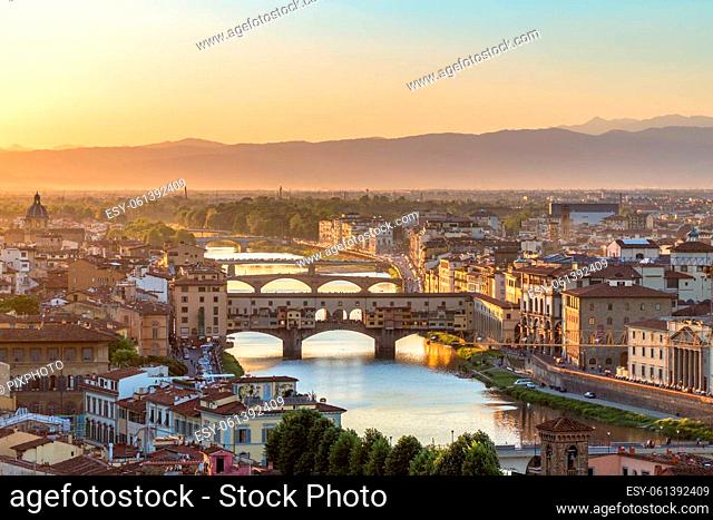 City of Florence at sunset with the Ponte Vecchio bridge