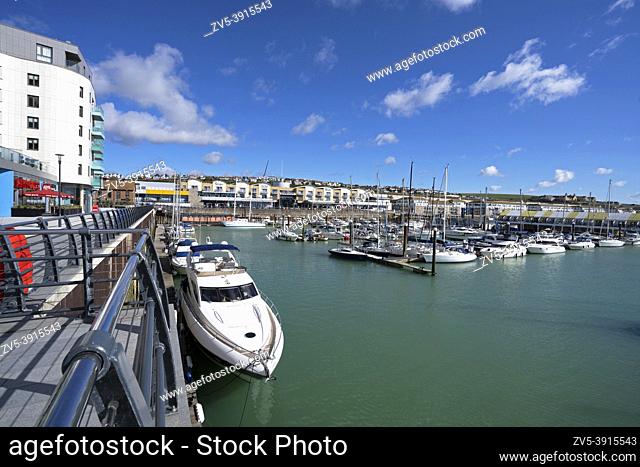 Apartments and moored yachts at Brighton Marina, Brighton, East Sussex, England, Uk