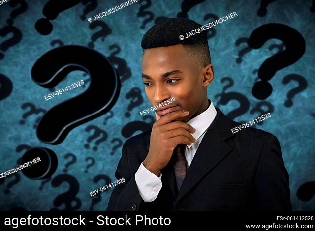 doubt emotion facial expression pensive thinking young creative man question mark