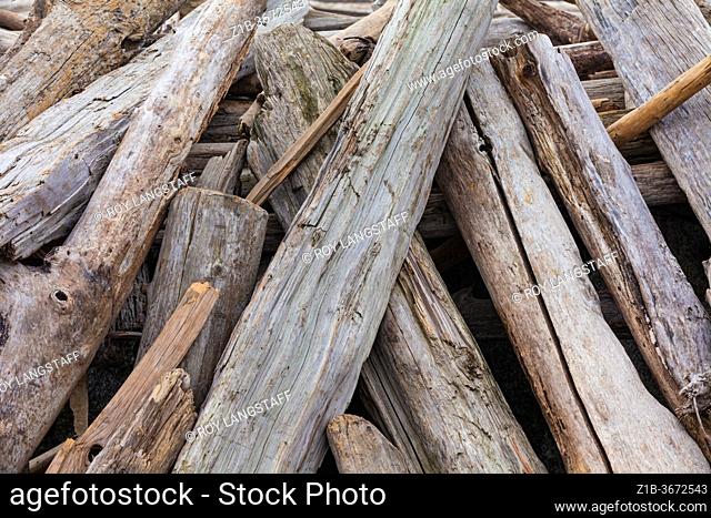 Abstract image of stacked driftwood on the beach at Stevesto British Columbia Canada