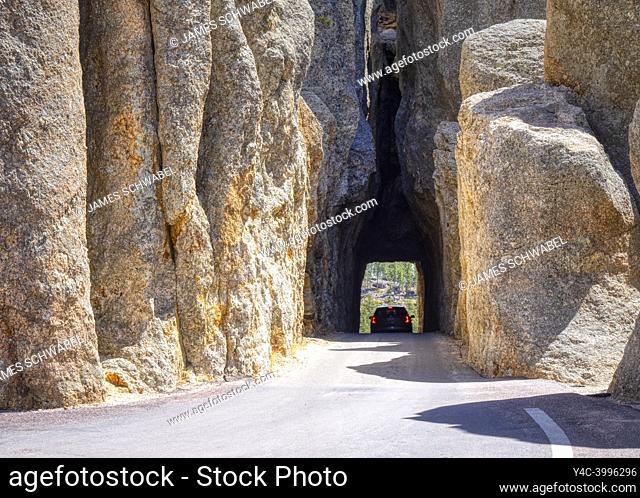 Car in Needles Eye Tunnel on the Needles Highway in Custer State Park in the Black Hills of South Dakota USA
