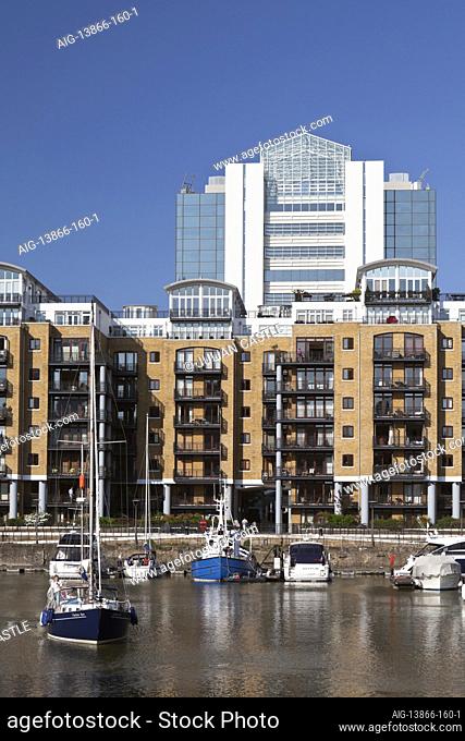 Luxury residential flats and boats at St Katherine's Dock, London, E1, England, UK