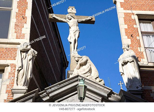 Crucifix above the entrance gate of Sint Vincentius Huis, Sint Egidiusgemeenschap, Antwerp. Belgium