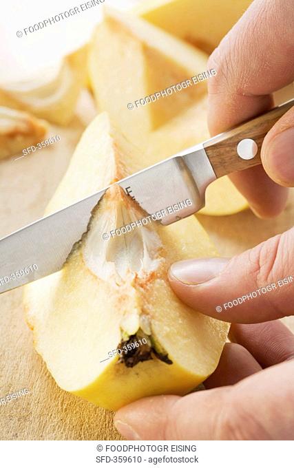A quince being de-cored