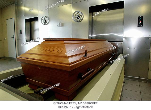 A casket will be brought in a crematorium