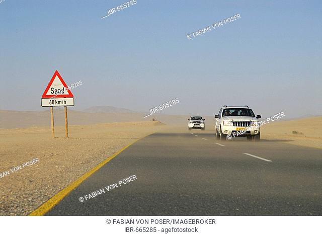 Road sign warning of sweeping sands on a highway near Luederitz, Namibia, Africa