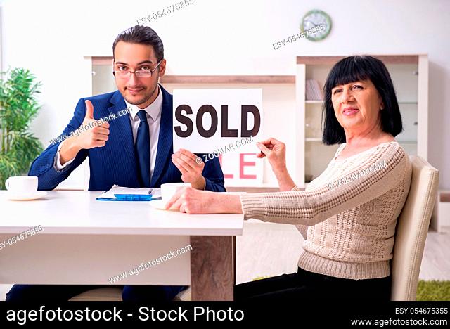 The male real estate agent and female client in the apartment