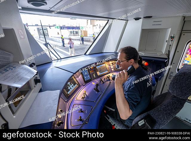 21 August 2023, Saxony, Chemnitz: Railcar driver Marcell Pellot sits in the cockpit of an Alstom Coradia Continental battery train at Chemnitz main station