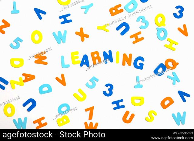 Colorful letters and the word learning on white background, learning or study concept various colors