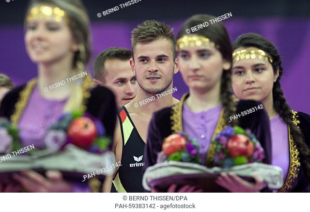 Germany's Martin Gromowski (L) and Kyrylo Sonn during the medal ceremony for the Trampoline - Men's Synchronised at the Baku 2015 European Games in National...