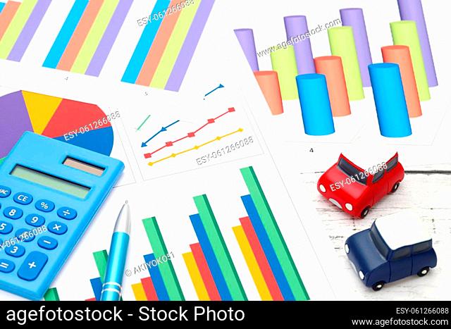 toy car and color chart printed documents, calculator on the table