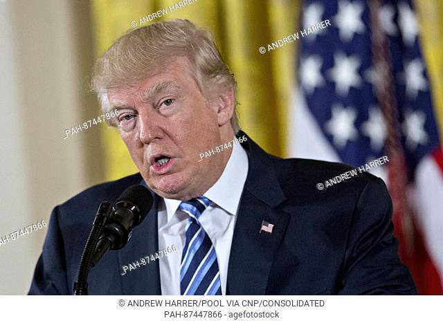 United States President Donald Trump speaks during a swearing in ceremony of White House senior staff in the East Room of the White House in Washington, D