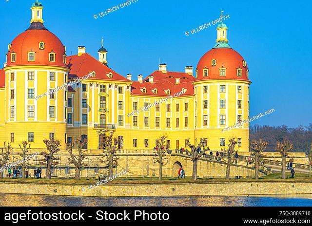 Moritzburg near Dresden, Saxony, Germany: Exterior view of Moritzburg Palace in winter with the palace pond half frozen over, from the South